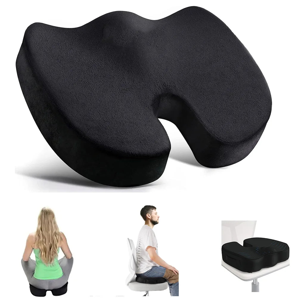 Black U-shaped seat cushion with people using it on a chair and floor.
